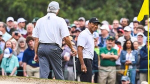 Tiger Woods smiles at Fred Couples at 2022 Masters