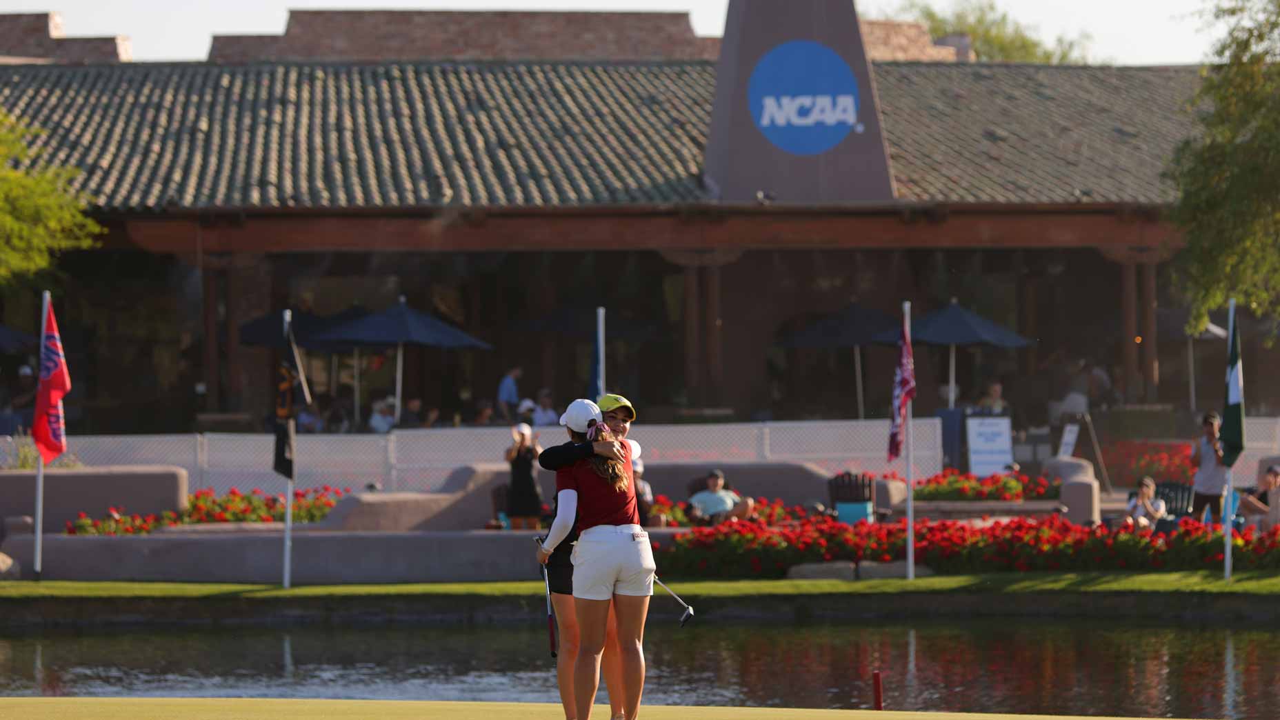 Briana Chacon of the Oregon Ducks hugs Sadie Englemann of the Stanford Cardinal after winning their match up during the Division I Womens Golf Championship held at the Grayhawk Golf Club on May 25, 2022 in Scottsdale, Arizona.