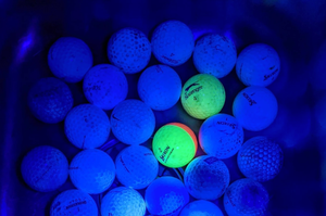 golf balls glowing in dark