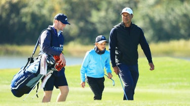 Joe LaCava Jr., Charlie Woods and Tiger Woods.