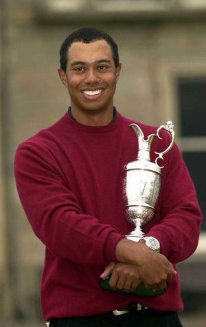 Tiger Woods holds the claret jug after his victory in the British Open Championships at the Old Course, St. Andrews, Scotland July 23, 2000.