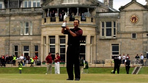 Tiger Woods of the USA holds the Claret Jug aloft in front of the R&A Clubhouse after securing a five shot victory at the 134th Open Championship at Old Course, St Andrews Golf Links, July 17, 2005 in St Andrews, Scotland.