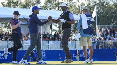 Vijay Singh of Fiji and his son Qass Singh celebrate after Vijay Singh had holed the winning putt on the 18th green during the final round of the 2022 PNC Championship at The Ritz-Carlton Golf Club on December 18, 2022 in Orlando, Florida.
