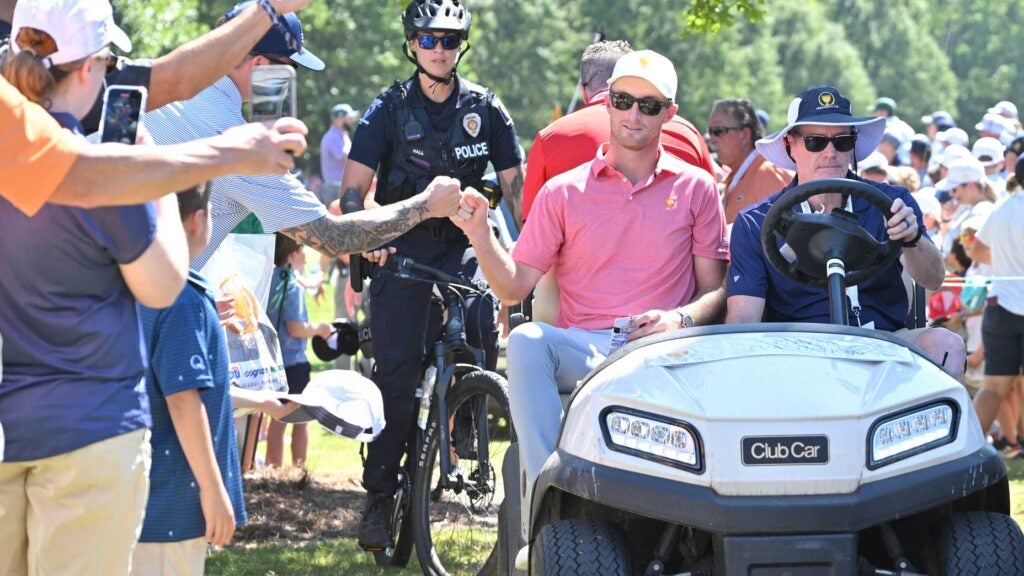 Golfer Will Zalatoris of the United States is escorted to the course prior to Presidents Cup at Quail Hollow September 21, 2022, in Charlotte, North Carolina.