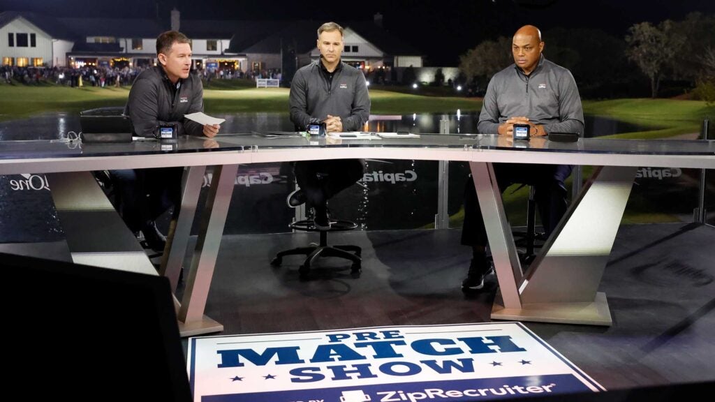 Host Brian Anderson, and commentators Trevor Immelman and Charles Barkley on set during The Match 7 at Pelican at Pelican Golf Club on December 10, 2022 in Belleair, Florida
