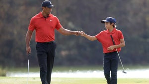 tiger and charlie woods fist bump