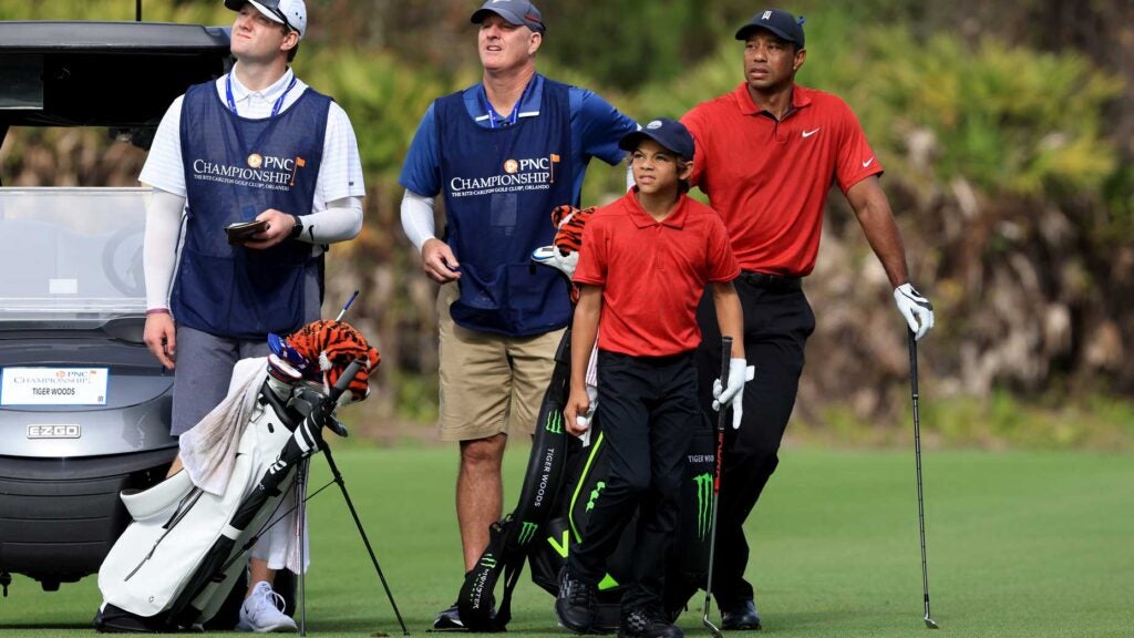 tiger stands with charlie woods