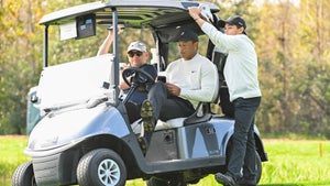 tiger woods and charlie woods talk on golf cart