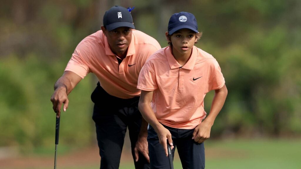 Tiger Woods and Charlie Woods read putt at 2021 PNC Championship