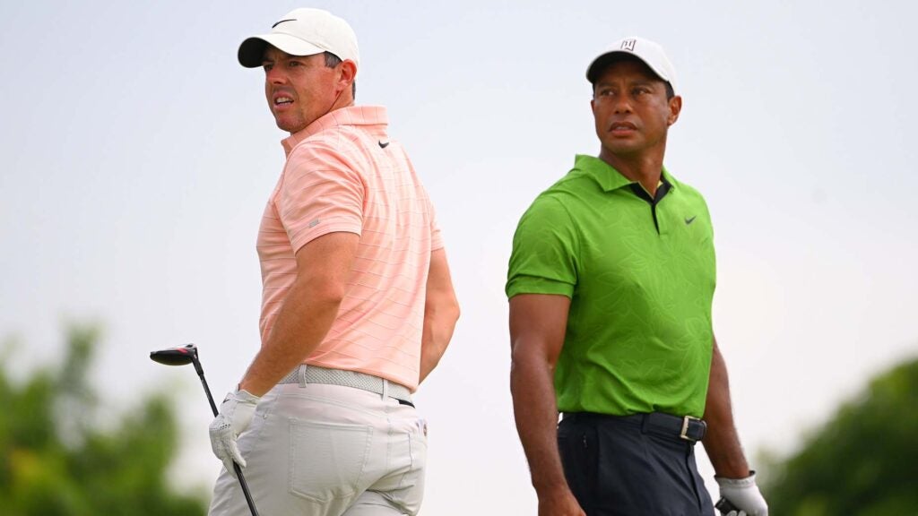 Rory McIlroy and Tiger Woods on course at 2022 PGA Championship