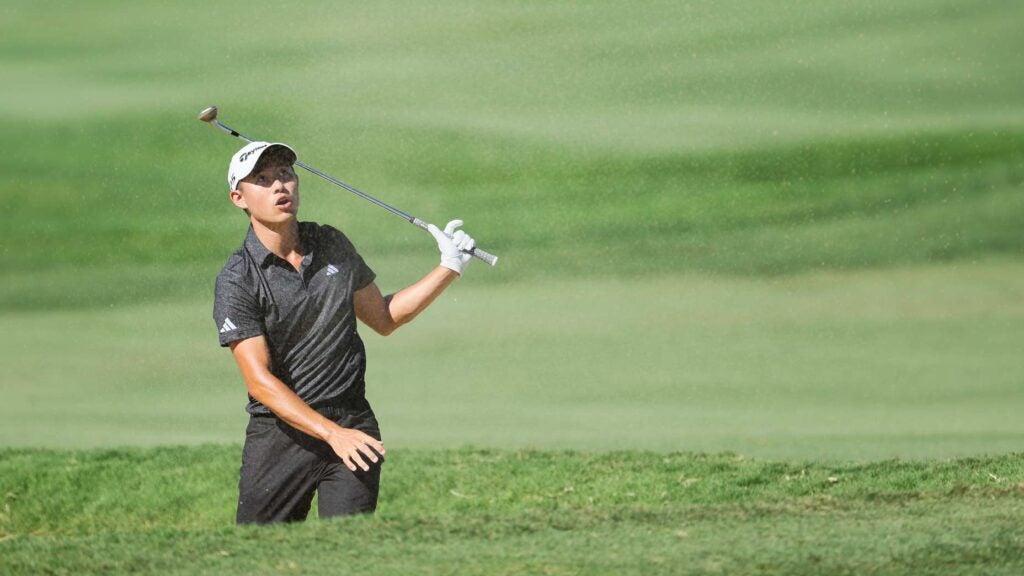 Collin Morikawa of the United States reacts to his shot from a bunker on the 14th hole during the final round of the Sentry Tournament of Champions at Plantation Course at Kapalua Golf Club on January 08, 2023 in Lahaina, Hawaii.