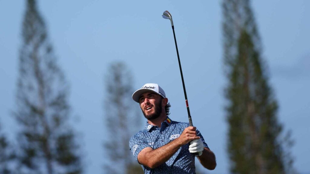 Max Homa poses over an iron shot at the Sentry Tournament of Champions.