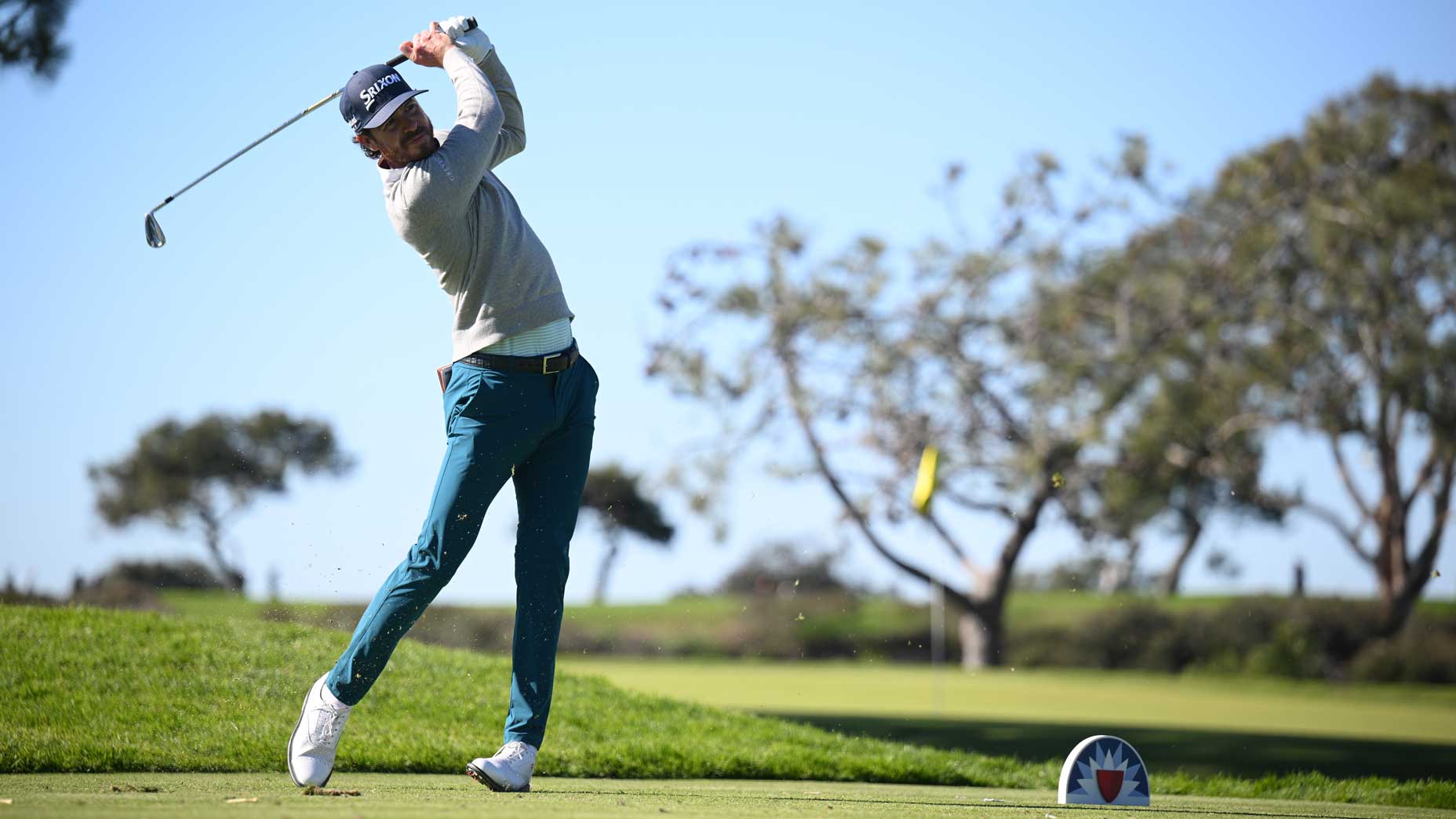 Sam Ryder of the United States plays his shot from the eighth tee of the South Course during the third round of the Farmers Insurance Open at Torrey Pines Golf Course on January 27, 2023 in La Jolla, California.