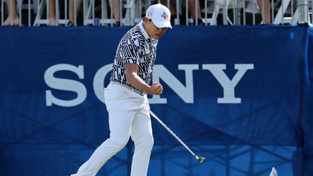 Si Woo Kim of South Korea reacts to his birdie putt on the 18th green during the final round of the Sony Open in Hawaii at Waialae Country Club on January 15, 2023 in Honolulu, Hawaii.