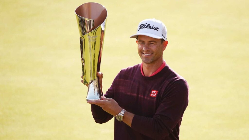 Adam Scott poses with the trophy after winning the Genesis Invitational in February 2020.
