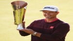 Adam Scott poses with the trophy after winning the Genesis Invitational in February 2020.