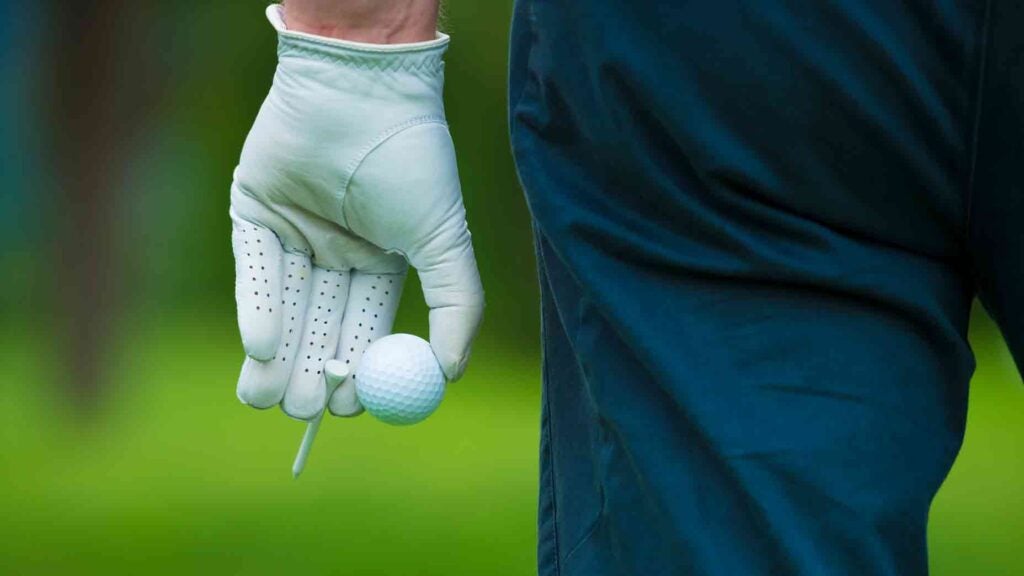 golfer holding ball