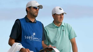 Jordan Spieth and caddie watch play at 2019 Sony Open