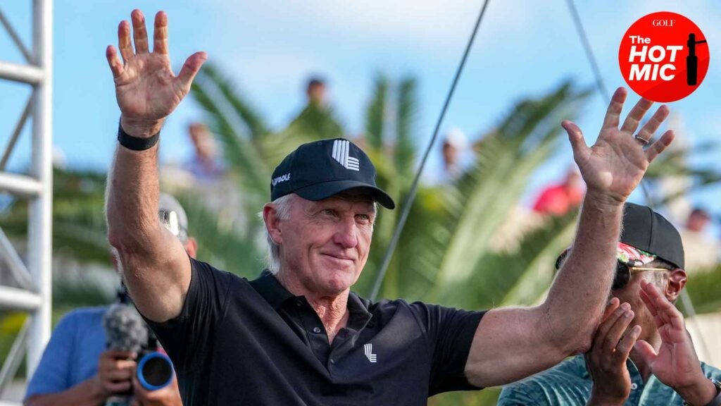 greg norman holds hands up