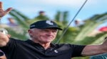 greg norman holds hands up