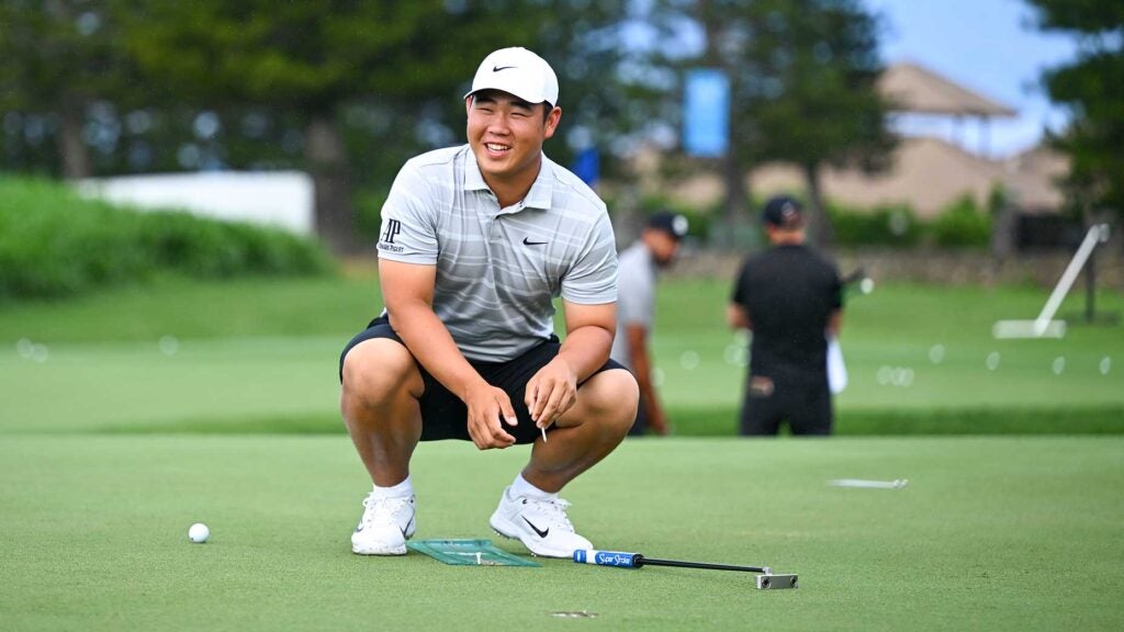 Tom Kim gets in work on the putting green during the Sentry Tournament of Champions on The Plantation Course at Kapalua on Tuesday.