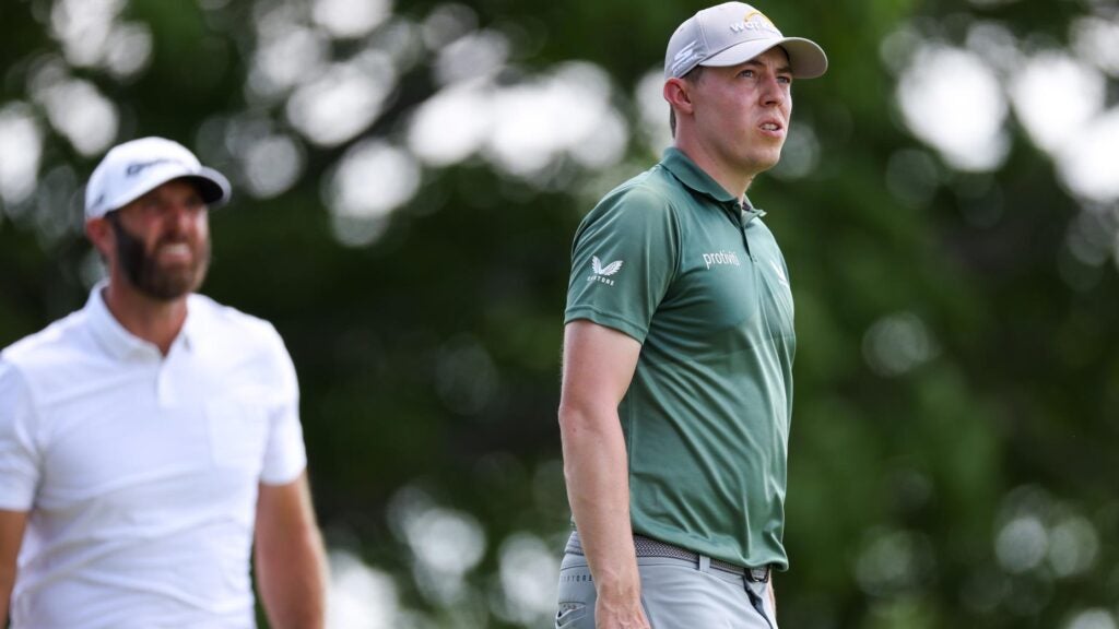 Matt Fitzpatrick of England and Dustin Johnson of the United States wait on the seventh green during the second round of the 122nd U.S. Open Championship at The Country Club on June 17, 2022 in Brookline, Massachusetts.
