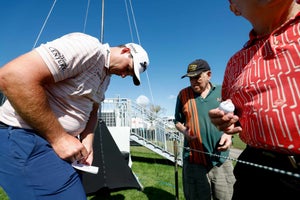 Sepp Straka of Austria signs autographs for fans on the ninth green during the pro-am prior to The Honda Classic at PGA National Resort And Spa on February 22, 2023 in Palm Beach Gardens, Florida.