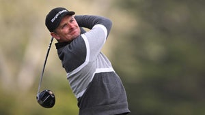 justin rose hits a tee shot on sunday at pebble beach.