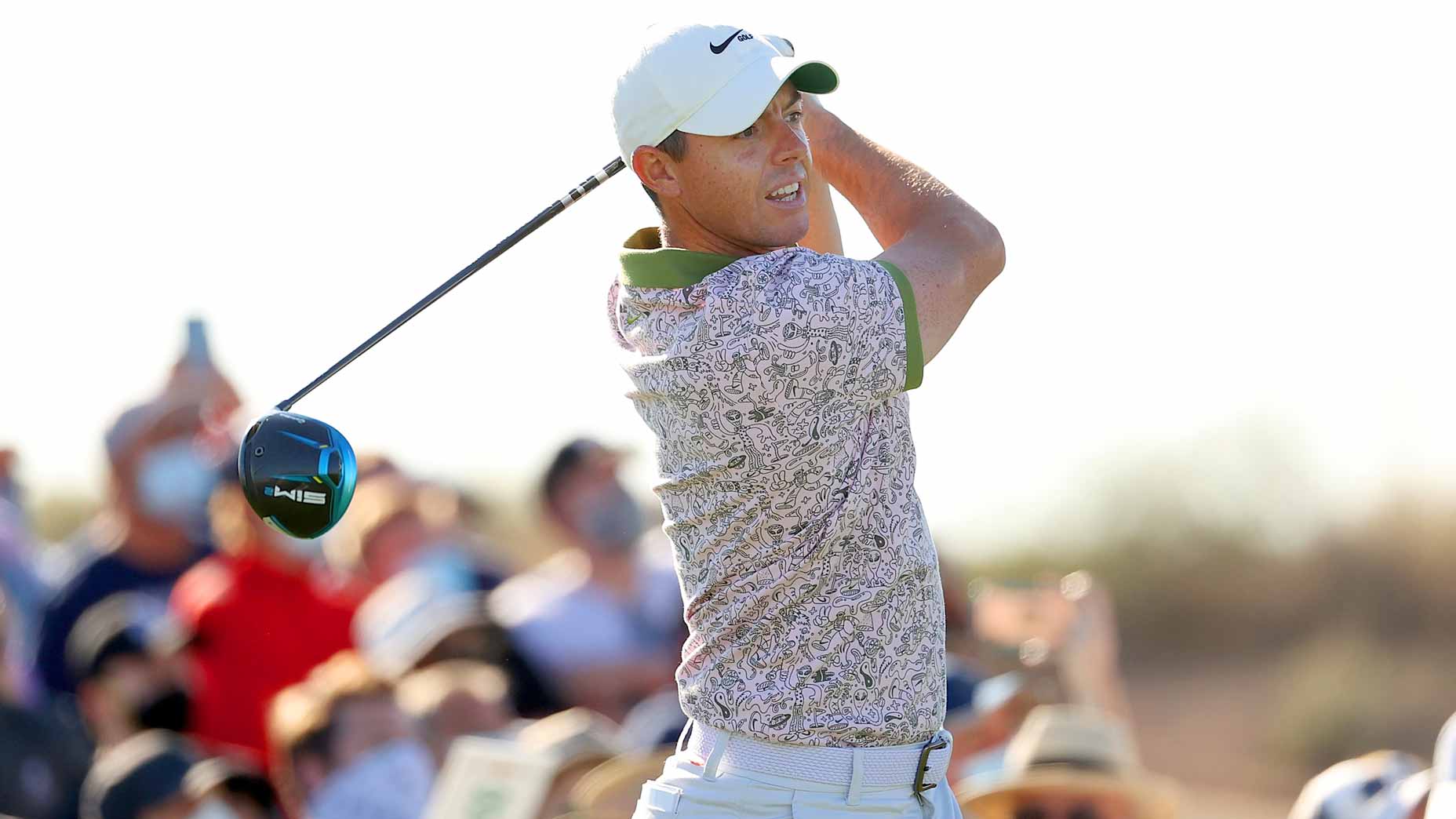 Rory McIlroy watches drive at the 2021 WM Phoenix Open