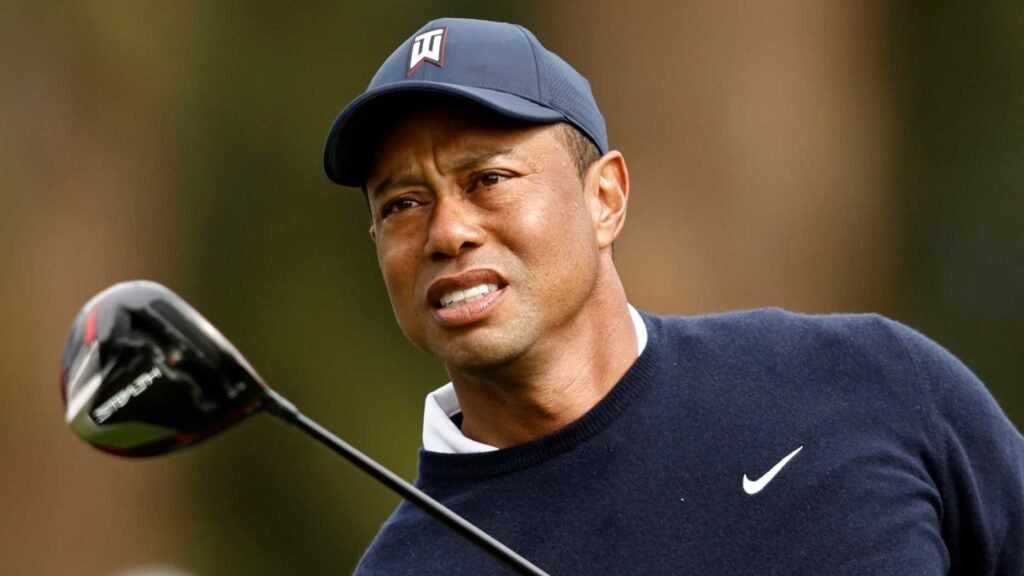 Tiger Woods watches drive during 2023 Genesis Invitational