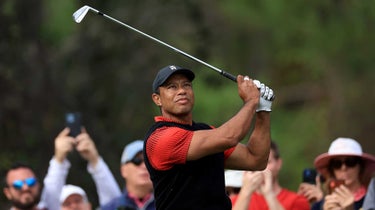 tiger woods watches a shot