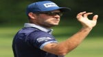 Corey Conners catches golf ball during PGA Tour tournament