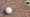 golf ball on gravel