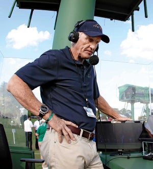Greg Norman looks on from the SiriusXM radio booth near the 18th green during the final round of the Masters in 2021.