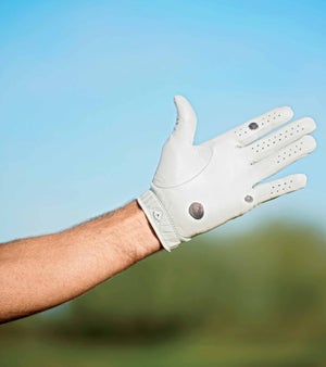 person's hand with glove on