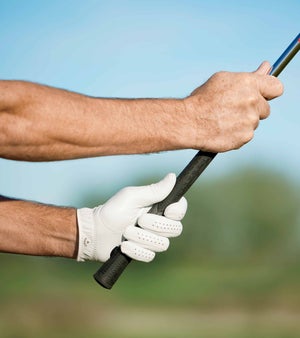 two hands on a golf club