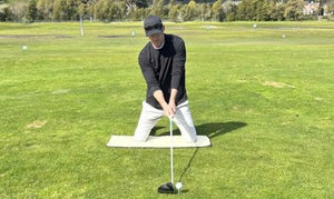 Setting up to hit a driver while kneeling