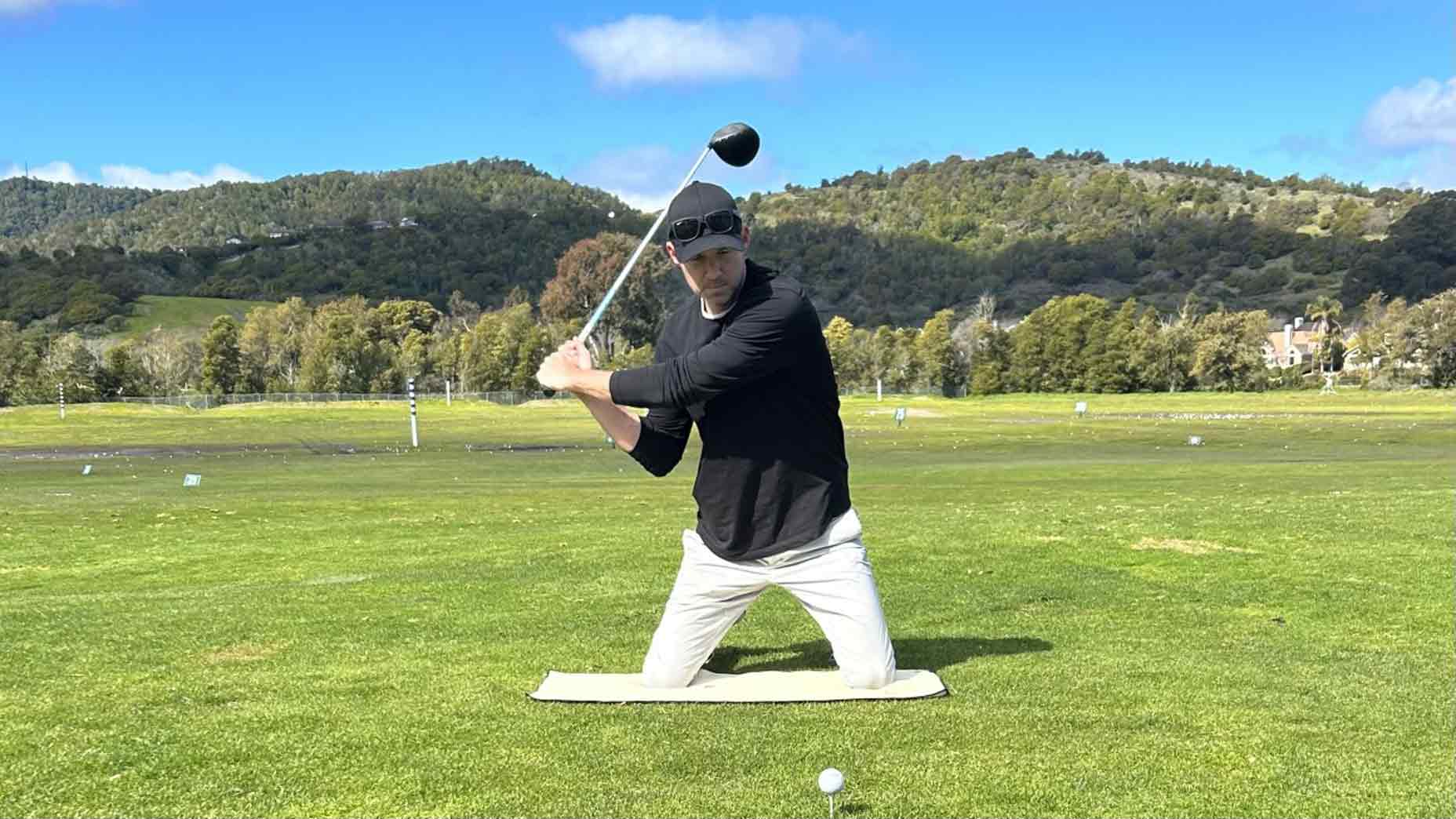GOLF Teacher to Watch Kelvin Kelley demonstrates how hitting a driver while kneeling can improve your swing to hit stronger shots