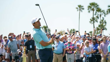 scottie scheffler watches a tee shot during the final round of the players championship