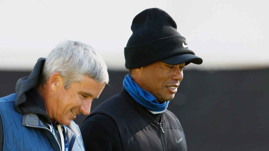 tiger woods and jay monahan walk