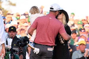AUGUSTA, GEORGIA - APRIL 09: Jon Rahm of Spain celebrates with his wife, Kelley, and son, Kepa, on the 18th green after winning the 2023 Masters Tournament at Augusta National Golf Club on April 09, 2023 in Augusta, Georgia. (Photo by Ross Kinnaird/Getty Images)
