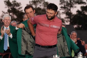 AUGUSTA, GEORGIA - APRIL 09: Jon Rahm of Spain is awarded the Green Jacket by 2022 Masters champion Scottie Scheffler of the United States during the Green Jacket Ceremony after Rahm won the 2023 Masters Tournament at Augusta National Golf Club on April 09, 2023 in Augusta, Georgia. (Photo by Christian Petersen/Getty Images)