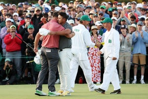 AUGUSTA, GEORGIA - APRIL 09: Jon Rahm of Spain hugs with Brooks Koepka of the United States on the 18th green after he won the 2023 Masters Tournament at Augusta National Golf Club on April 09, 2023 in Augusta, Georgia. (Photo by Christian Petersen/Getty Images)