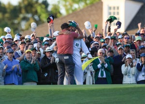 AUGUSTA, GEORGIA - APRIL 09: Jon Rahm of Spain celebrates holing the winning putt on the 18th green with his caddie Adam Hayes during the final round of the 2023 Masters Tournament at Augusta National Golf Club on April 09, 2023 in Augusta, Georgia. (Photo by David Cannon/Getty Images)