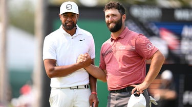 Tony Finau (L) of the United States shakes hands with Jon Rahm (R) of Spain after winning the Mexico Open at Vidanta on April 30, 2023 in Puerto Vallarta, Jalisco.