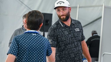 Current Master's champion, Jon Rahm of Spain, takes the time to chat and pose with Jimmy Williams from Make-A-Wish after his press conference and prior to RBC Heritage at Harbour Town Golf Links on April 12, 2023 in Hilton Head Island, South Carolina.