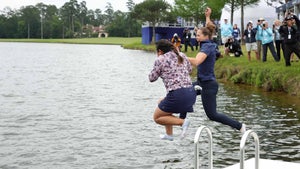 Lilia Vu (L) of the United States jumps in the water after winning in a one-hole playoff against Angel Yin (not pictured) of the United States during the final round of The Chevron Championship at The Club at Carlton Woods on April 23, 2023 in The Woodlands, Texas.
