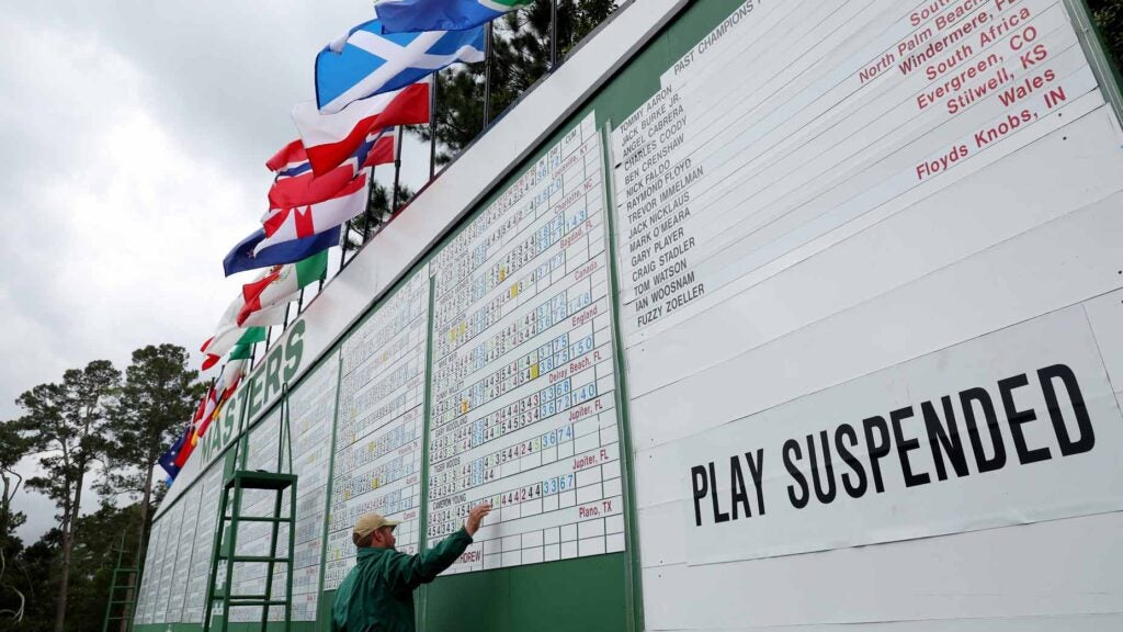 Signage that reads 'Play Suspended' due to weather on the leaderboard during the second round of the 2023 Masters Tournament at Augusta National Golf Club on April 07, 2023 in Augusta, Georgia.