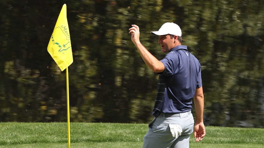 Scottie Scheffler of the United States reacts to his hole-in-one on the ninth green during the Par 3 contest prior to the 2023 Masters Tournament at Augusta National Golf Club on April 05, 2023 in Augusta, Georgia.