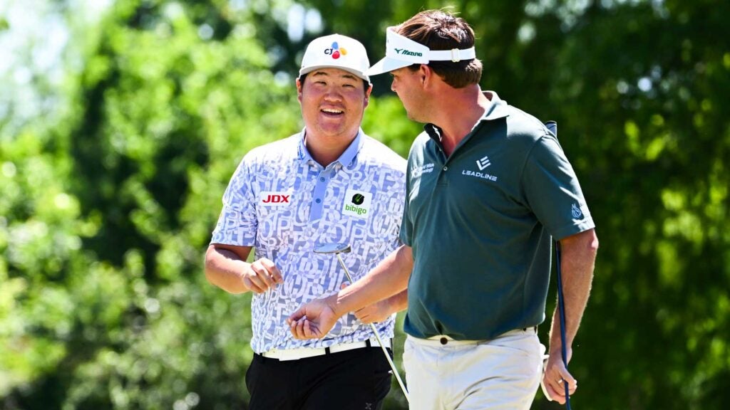 Sungjae Im of South Korea celebrates with his teammate, Keith Mitchell at the second hole during the third round of the Zurich Classic of New Orleans at TPC Louisiana on April 22, 2023 in Avondale, Louisiana.